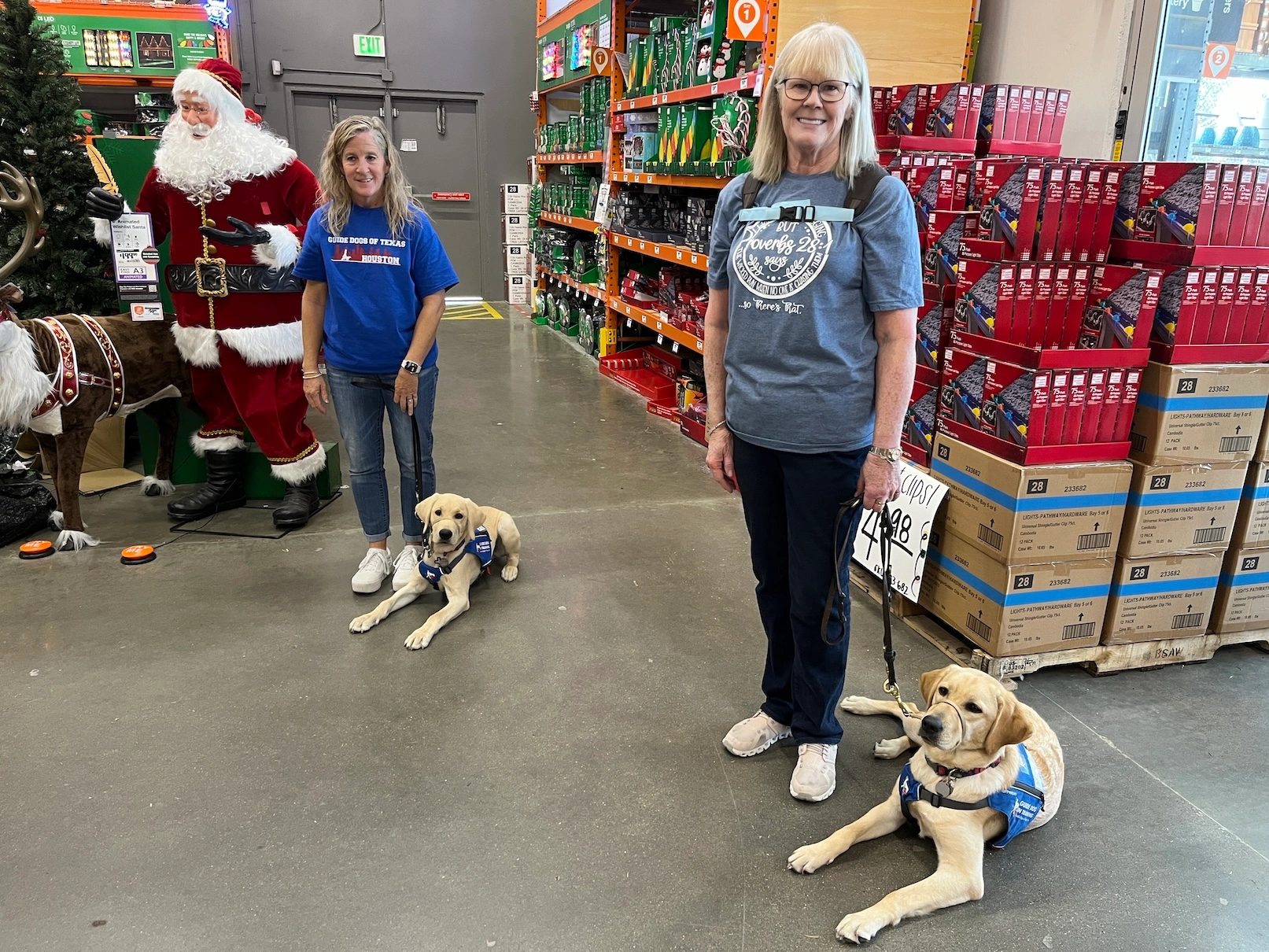 2 raisers with puppies in training during Christmas time